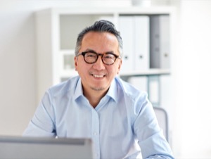 Guy in blue shirt smiling at camera